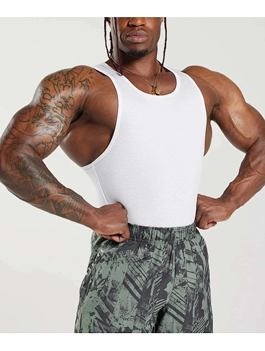 Maximize your workout with our stringer tank tops. Designed for optimal comfort and mobility, this tank allows for a full range of motion during any exercise.